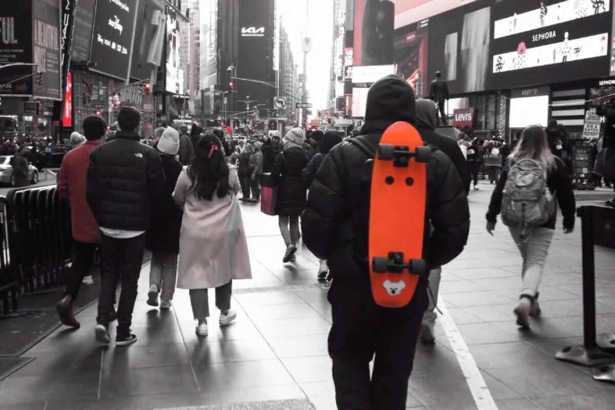 Attach skateboard to clearance backpack